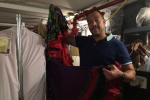 Ballet Hispanico artistic director Eduardo Vilaro holds up a flamenco skirt that was drenched when the studio basement flooded on Monday. DNAinfo/Kathleen Culliton